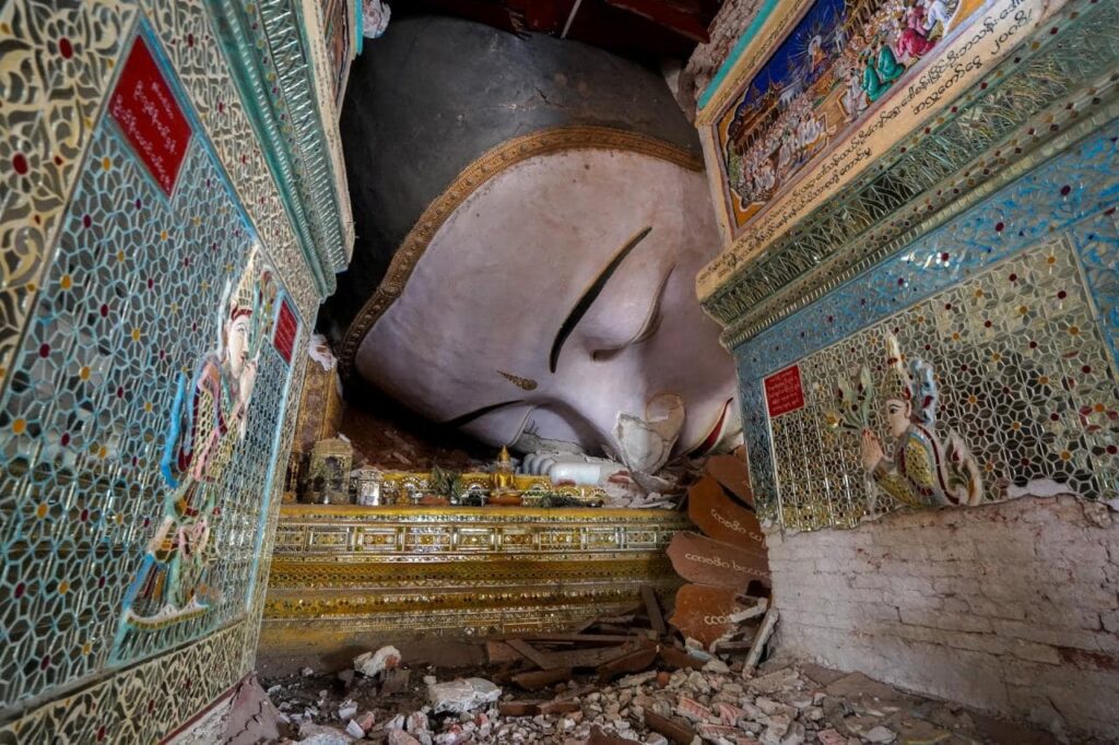 A damaged lying Buddhist statue is pictured inside a pagoda following an earthquake in Mandalay, Myanmar, April 3, 2025