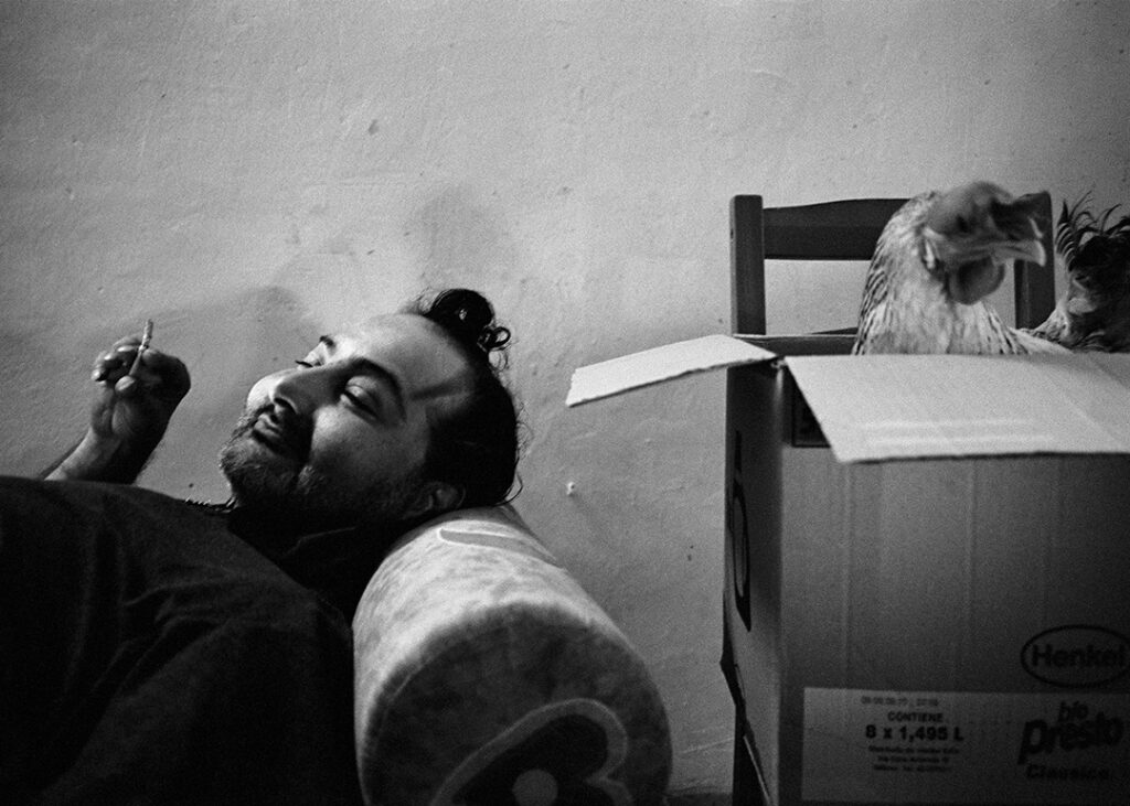 Alfonso and his chiken. Alfonso represents who in Napoli is called “femminiello” (a transvestite). Once he was a sex workers.He told me that in the past the affairs went good but the price to pay for a life spent on the road, was to be insulted and molested. Those bad experiences still cause to him nightmares and panic attacks. Since Alfonso can’t pay the rent alone, his sisters give him a hand. He earns money by reading neapolitan playing cards. Sometimes he sells smuggling cigarettes
"In my life, happy moments are so rare while bad ones are too many." (Alfonso)