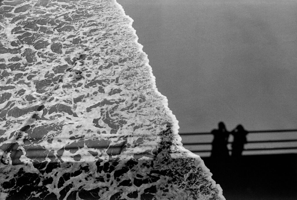 USA. Santa Monica, California. 1979. Shadows on sea and sand.