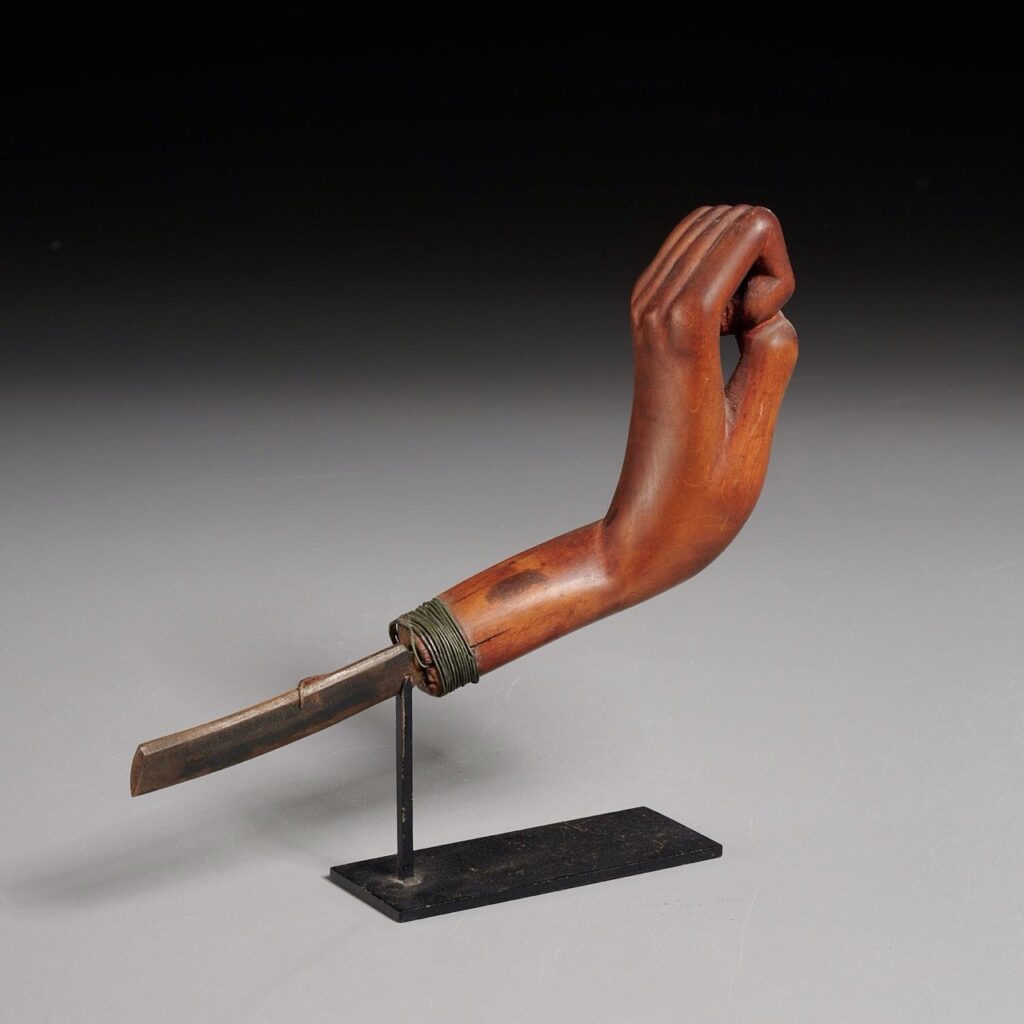 Antique crooked knife with carved hand handle. 19th c., likely Iroquois, New York State, iron blade, finely carved wood 