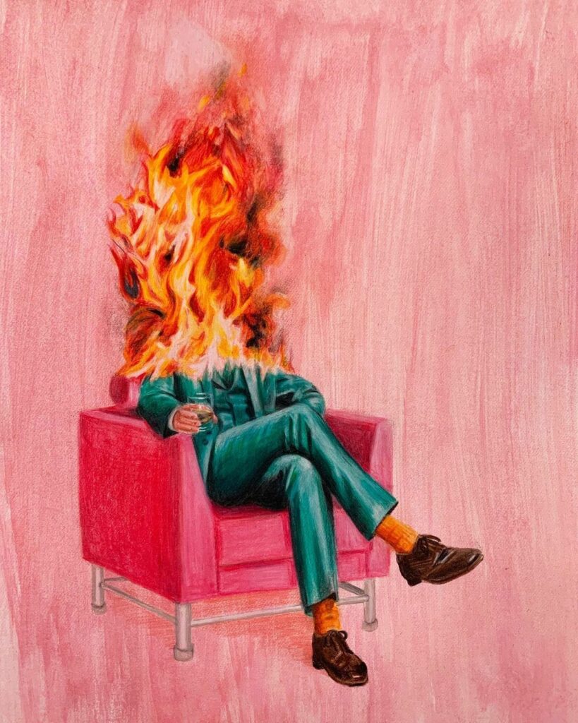 installé confortablement dans un fauteuil rose, un homme la tête en feu